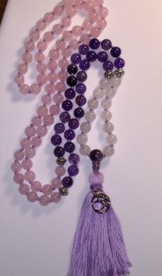 "Zen 108 Bead Mala. Silver spacer beads marked at 7-14-66. Silver marker beads with Amethyst guru bead, tassel and Om charm. Mala or Buddhist prayer beads, are a traditional tool used to count the number of times a mantra or the name or names of a deity is recited while meditating. The mala is used so that one can focus on the meaning or sound of the mantra rather than counting its repetitions. They are similar to other forms of prayer beads used in various world religions.  They are usually mad Hand-strung Purple Bohemian Beads, Bohemian Hand-strung Purple Beads, Purple Hand-strung Bohemian Beads, Purple Bohemian Hand-strung Beads, Spiritual Purple Beaded Bracelets For Meditation, Spiritual Purple Spacer Beads, Purple Round Beads Bracelet For Meditation, Purple Round Beaded Bracelets For Meditation, Purple Bohemian Beaded Bracelets For Meditation