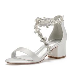 a women's white high heeled sandal with crystal embellishment