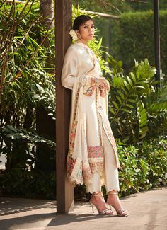 Editor's Note Featuring an ivory chanderi front open kurta enhanced with patchwork along the centre and hem. It is paired with ivory chanderi trousers and a georgette dupatta accentuated with mukesh, lace and patchwork border. Fabric: Chanderi - top & trousers, georgette - dupatta Color: Black Component: Kurta, trousers & dupatta Sleeve type: Full Neckline: Mandarin Occasion: Wedding Care: Dry Clean Only About the Designer Varun’s work marries the beauty of heritage Indian handcrafted embroideri Varun Bahl, Chanderi Dupatta, Georgette Dupatta, White Kurta, Types Of Work, Luxury Sale, Embroidered Dupatta, Ivory Tops, Straight Kurta