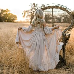 A beautiful photography piece. This is a linen blend romper with ruffled floor length skirt that opens up in front. Underneath is a pair of bloomer shorts. It is off-the-shoulder with elastic in the back. The sleeves are elastic and attached to the dress. Garment measurements (Length is top of shoulder seam to hem.) 12m chest 19in Length 22in 18m chest 20in Length 25in 2t chest 20.5in Length 30in 3t chest 21in Length 32in 4t chest 22in Length 34in 5t chest 23in Length 36in 6t chest 24in Length 3 Kids Bridesmaid Dress, Girls Boho Dress, Boho Toddler, Bloomer Shorts, Alternative Bride, Family Picture Outfits, Future Family, Ruffled Dress, Floor Length Skirt