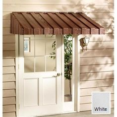 a white door with a brown awning over it