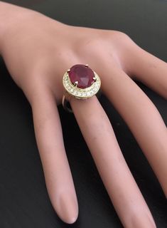 11.75 Carats Impressive Natural Red Ruby and Diamond 14K Yellow Gold Ring Suggested Replacement Value: $6,800.00 Total Red Ruby Weight is: Approx. 11.00 Carats (Lead Glass Filled) Ruby Measures: Approx. 14.00 x 11.00mm Natural Round Diamonds Weight: Approx. 0.75 Carats (color G-H / Clarity SI) Ring total weight: Approx. 7.8 grams Disclaimer: all weights, measurements and colors are approximate and may vary slightly from the listed dimensions or as seen in the image. All pictures are magnified to Luxury Red Ruby Gemstone Ring, Luxury Red Gemstone Diamond Ring, Luxury Red Oval Rings, Luxury Red Diamond Ring With Gemstone, Gia Certified Oval Red Diamond Ring, Luxury Red Ruby Ring For Formal Occasions, Luxury Gia Certified Ruby Ring, Red Ruby Round Ring, Luxury, Gia Certified Red Ruby Ring