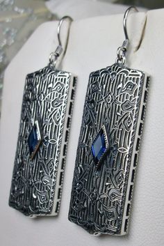 Rectangle Art Deco style earrings with fine lace filigree and a diamond shaped blue sapphire gemstone in the center of the lace filigree field, traditional shepherd hook style ear wire closures Vintage Nickel-free Earrings For Evening, Nickel-free Vintage Earrings For Evening, Art Deco Metal Earrings For Evening, Classic Silver Pierced Plug Earrings, Art Deco Drop Earrings For Evening, Vintage Nickel-free Jewelry For Evening, Nickel-free Vintage Jewelry For Evening, Nickel Free Vintage Jewelry For Evening, Antique Nickel-free Earrings For Party