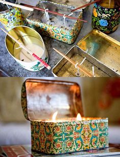 an open box sitting on top of a table next to a candle and some other items