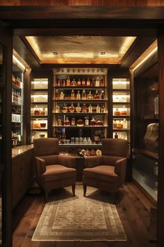 two brown chairs sitting on top of a wooden floor next to shelves filled with bottles