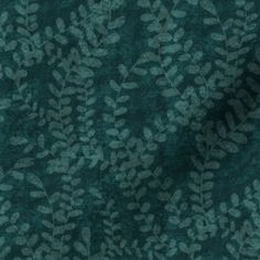 a dark green background with leaves on the top and bottom, as well as an image of