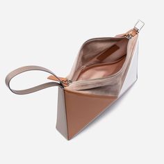 Our architectural, origami inspired shoulder bag, now has a new dimension. It can be converted into a wrist bag just with a quick move. The shoulder strap can easily be removed, so you can slung it from your wrist or use as a clutch. It has plenty of room inside for your essentials including a large phone, small wallet Modern Leather Handheld Clutch, Modern Rectangular Pouch, Modern Clutch With Detachable Strap, Modern Office Clutch With Removable Pouch, Modern Crossbody Clutch With Removable Pouch, Luxury Geometric Shoulder Bag For Everyday Use, Modern Clutch For Daily Use, Modern Clutch Pouch For Office, Modern Office Clutch Pouch