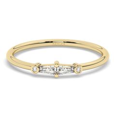 This 14k gold diamond ring comes with tapered baguettes and round diamond. Great as a solo piece and with stacking rings. ** Half and quarter sizes available. M A T E R I A L & L E N G T H Available in 14k Yellow Gold, 14k Rose Gold, 14k White Gold, Sterling Silver, 18k Yellow Gold, 18k Rose Gold, 18k White Gold Stone: Natural Diamonds Diamond:  2 tapered baguette 3.5x2x1.3 mm and 2x 0.9 mm round Carat Weight: Baguette 0.14 ct. Round 0.01 ct. Color: G  Quality: SI-VS Additional Notes: * Non-Conflict Diamonds * Made in the USA E X C H A N G E / R E T U R N ∙ P O L I C Y Please let us know within 7 days of receipt. Ship the item back to us in its original condition. Get a full refund. Personalized items can be exchanged with 20% restocking fee. Full eternity bands can be exchanged with 15% r Promise Ring With Baguette Diamonds, Yellow Gold Baguette Diamond Ring, Baguette Diamond Ring In Yellow Gold, Gold Baguette Cut Diamond Ring, Baguette Yellow Gold Diamond Ring, Baguette Diamond Ring With Single Cut Diamonds For Anniversary, 14k Gold Diamond Ring With Baguette Diamonds, Gold Diamond Promise Ring With Baguette Diamonds, Gold Diamond Ring With Baguette Diamonds For Promise