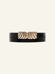 Add a luxurious statement to your everyday look with the Selene Belt. Made with 100% leather with a stone detail and a beautiful custom gold statement buckle. Item Details: Metal buckle detail Adjustment: 8 holes Strap Width: 20mm Genuine Leather Sizing: XS/S: 32'’: Depending on where you like your belt to sit, fits women’s 24, 25, 26, 27 jean size. M/L: 37'': Depending on where you like your belt to sit, fits women’s 27, 28, 29, 30 jean size. Measurement is taken from the buckle point to the third hole. Gift Wrapping Available Each piece comes in its own luxury Love Isabelle Packaging with one gift box per order. Luxury Belt Buckles With Removable Belt For Evening, Black Belt Buckles With Gold-tone Hardware For Work, Leather Belt With Gold-tone Hardware For Evening, Leather Belts With Gold-tone Hardware For Evening, Black Belts With Gold-tone Hardware For Evening, Luxury Black Belt Buckles With Gold-tone Hardware, Chic Leather Belt With Gold Buckle, Elegant Gold Belts, Modern Black Belt Buckles For Evening