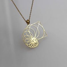 Fibonacci 14k 18k Real Gold Necklace Pendant - Geometric Jewelry - Geometric Pendant - Gold in Fibonacci ▶ 14K Solid Gold (585) ▶ 18K Solid Gold (750) ▶ Options: White,Rose,Yellow ▶ You can buy this necklace without chain. ABOUT NECKLACE Handmade with 14k/18k solid real gold. You can order this Fibonacci  gold  necklace with 3 different color options, 5 different necklace length options and free & express shipping to the all-around the world. What is 14k Gold? 14K gold is a mixture which primarily consists of gold that is blended with durable metals such as zinc, nickel, and copper. Gold by itself is relatively soft, so the alloy metals are to strengthen the composition. 14 Karat specifically refers to the metal mixture that is 58.5% gold. To understand whether it is made with 14K gold or Sacred Geometry Jewelry, Gold Necklace Pendant, Real Gold Necklace, Science Jewelry, Spiral Necklace, Laser Cut Jewelry, Rose Yellow, Geometric Pendant, Geometric Jewelry