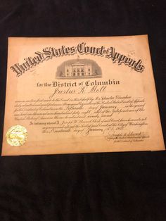 an old certificate is laying on a black cloth with the words, united states court of appeals