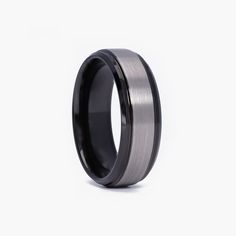 Unique men's promise ring in brushed black tungsten, custom-engraved with a special name or phrase, reflecting a modern and bold style Black Titanium Anniversary Rings, Classic Titanium Jewelry For Gifts, Formal Stainless Steel Round Band Ring, Timeless Stainless Steel Rings As A Gift, Timeless Stainless Steel Rings For Gift, Timeless Stainless Steel Rings As Gift, Timeless Stainless Steel Gift Rings, Classic Titanium Ring With Polished Finish, Stainless Steel Ring With Brushed Finish As Gift