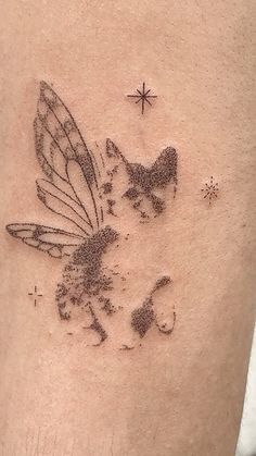 a small tattoo on the back of a man's leg with a cat and butterfly