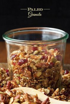 granola in a glass jar with wooden spoon