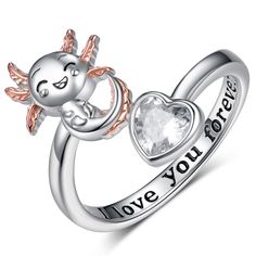 PRICES MAY VARY. Axolotl Ring for Girls Design: Inspired by the Axolotl, a fun and friendly amphibian, the axolotl jewelry is engraved with the words "I love you forever." Its fluffy gills and infectious smile are unique in the world. This cute animal Axolotl Ring is perfect for everyday wear and any occasion. Axolotl Ring Material: Made of 925 sterling silver and heart-shaped cubic zirconia, this Adjustable Axolotl Open Ring is designed to make the entire ring sparkle on your hand, ensuring tha Axolotl Clay Ring, Gold Axolotl, Axolotl Gift Ideas, Axolotl Ring, Axolotl Jewelry, Axolotl Figurine, Cute Axolotl, Women Design, Adjustable Jewelry