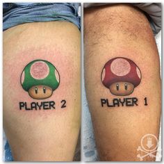 two tattoos that say player 2 and the other has a mushroom on their thighs