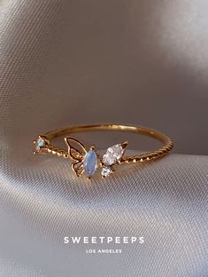 Product Details + Care - 18K Gold Dipped Over Brass - Brass: Copper + Zinc Alloy - 1 Ring - Wipe Clean - Imported Dimensions - Size is 6 Have a question? Please message info@shopsweetpeeps.com and our support team will get back to you in 48 hours. Butterfly Gold Ring, Cute Promise Rings, Edgy Jewelry, Cute Engagement Rings, Future Engagement Rings, Butterfly Ring, Dainty Gold Necklace, Silver Jewelry Pendant, Jewelry Accessories Ideas