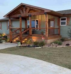 a small house with a porch and stairs