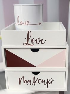 three boxes with different designs and words on them that say love, love, makeup