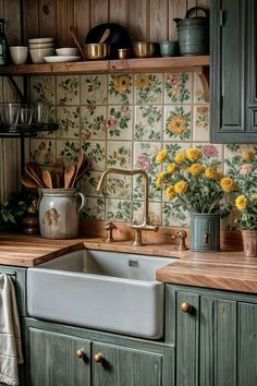 a kitchen with green cabinets and yellow flowers