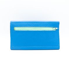 Sky BlueTHE wallet. Functions like a dream, holds all you need, doubles as a clutch. Available in a myriad of colorful leather options, so you can choose the one that is perfectly you. This classic design features 6 credit card slots, a compartment for organizing bills and receipts, and a back zippered coin pocket— all in a slender silhouette. The sleeve of this wallet also holds your phone, so feel free to carry it solo anytime you feel like getting dressed up. Available in soft chrome tanned l Modern Bifold Clutch With Card Slots, Modern Blue Leather Clutch, Blue Rectangular Card Holder For Personal Use, Modern Clutch Wallet With Card Slots, Blue Card Holder With Rfid Blocking For Daily Use, Blue Rfid Blocking Card Holder For Daily Use, Blue Rfid Blocking Card Holder For Everyday, Compact Blue Coin Purse For Everyday Use, Blue Rectangular Rfid Blocking Bag