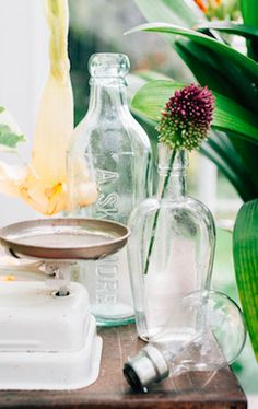 some glass bottles are sitting on a table