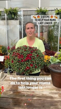 a woman holding a potted plant in front of her face with the caption, the first thing you can do to help your mums last longer