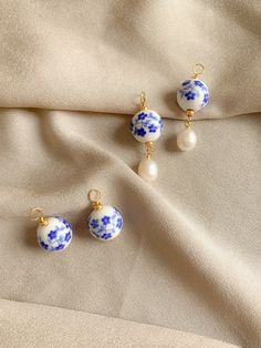 Description Delft Inspired charms are sold in pairs Hoops are not included, gold plated hoops and gold filled hoops listed separately Made with porcelain beads and freshwater pearls Please allow for slight variations from the photos due to every pair being handmade Care: Secure them in a jewelry bag or box when traveling. Porcelain Jewelry Handmade, Delft Jewelry, Earring Inspo, Porcelain Beads, Gold Filled Hoops, Porcelain Jewelry, In Pairs, Jewelry Bag, Bead Jewellery