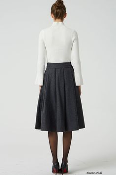 Elegant Wool Pleated Skirt With Lining, Wool Pleated Office Skirt, Elegant Winter Pleated Flared Skirt, Elegant Gray Pleated Lined Skirt, Elegant Gray Lined Pleated Skirt, Elegant Wool Pleated Skirt For Fall, Elegant Fitted Gray Pleated Skirt, Formal Knee-length Gray Skirt, Formal Gray Knee-length Skirt