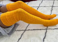 Beautiful thigh high extra long yellow cable knit sweater socks. These socks are 27-30 inches long and are perfect for over the knee boots and are true thigh high socks! Scrunch the socks for a slouchy look stretch up to wear as thigh high socks. These socks are longer in length than our green and black cable knit socks Details: *One size fits most (6-10) *Material: Acrylic *Soft, stretch fit (27-30 inches long!) *Designed and made in the USA! Care: Machine wash cold Colors may vary due to monit Sweater Thigh High Socks, Yellow Cable Knit Sweater, Cable Knit Socks, Women's Over The Knee Boots, Cabin Socks, Sweater Socks, Over The Knee Socks, Thigh High Socks, Thigh High Stockings