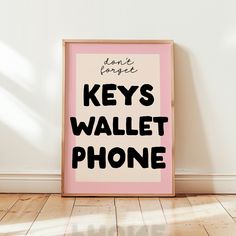 a pink and black poster with the words don't forget keys wallet phone on it