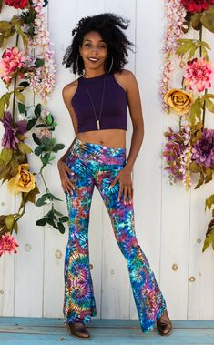 The Slim Bell Pants are the go to every day pant...comfortable is sexy. Design Features: Original Tie Dye Artwork created BenJammin of The Jammin Warrior Collective Wider waistband hits just under belly button Low rise center seam Hugs hips and legs to knee Slight flare at knee Great for every day, dance, movement, hooping and yoga Made in San Francisco, CA, USA Fabric Features: American Made Fabric printed in our studio in Novato, CA. Soft textured velvet. 90% Polyester / 10% Spandex. Fit: True 70s Festival, Velvet Bell Bottoms, Coral Tie, Flaming Lips, Velvet Flare Pants, Warrior Within, Bell Pants, Tie Dye Jumpsuit, Velvet Hoodie