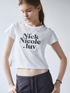 This signature t-shirt from NICK&NICOLE exudes a kitschy yet minimal mood, highlighted by the new season's Nick Nicole Luv logo print.- Cropped length that makes your look stylish- Made with a soft touch for comfortable wear- A basic item with high versatility White Cropped T-shirt With Logo Print For Spring, Trendy Streetwear T-shirt With Logo, Trendy Logo T-shirt For Streetwear, Spring White Cropped T-shirt With Logo, Trendy Logo Tops For Spring, Trendy Tops With Logo For Spring, White Fitted Logo Top, Fitted Logo Top With Short Sleeves, White Fitted Top With Logo