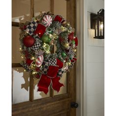 a christmas wreath hanging on the front door