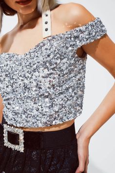 Our Sparkling Silver Cropped Sequin Glitter Top is a show-stopping addition to your party wardrobe, designed to make you stand out with its shimmer and style. Dazzling Sequin Embellishment: Adorned with sparkling silver sequins, this top catches the light beautifully, ensuring you're the center of attention. Chic Cropped Design: The cropped silhouette makes this top a trendy and flattering choice, perfect for pairing with high-waisted skirts or pants. Flattering Sweetheart Neckline: Featuring a Silver Sequin Top, Tan Scarf, Glitter Top, Fancy Dinner, Style Party, Running Tops, Silver Sequin, Sequin Top, Party Looks