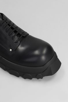 Lace Up Bozo Tractor Lace Up Shoes In Black Leather Modern Leather Lace-up Shoes With Vibram Sole, Modern Leather Shoes With Abzorb Midsole And Plain Toe, Calf Leather Lace-up Shoes With Lug Sole, Modern Leather Boots With Rubber Sole, Modern Slip-on Leather Shoes With Vibram Sole, Modern Leather Slip-on Shoes With Vibram Sole, Calf Leather Lace-up Shoes With Vibram Sole, Leather Low-top Lace-up Shoes With Studded Outsoles, Low-top Calf Leather Shoes With Vibram Sole