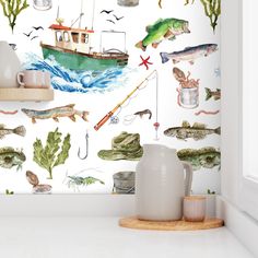 the wallpaper in this kitchen is decorated with fish and marine life, including a boat