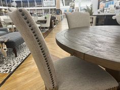 a dining room table and chairs in a store