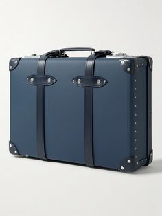 Globe-Trotter's 'Centenary' carry-on suitcase is part of the label's limited-edition capsule for its 125th anniversary, which is the number of pieces created for it. Punctuated with polished gold-tone hardware, it's been crafted in the UK from vulcanised fibreboard and has tonal leather straps and a telescopic handle for easy maneuvering. The 'Heritage Blue' colourway dates back to 1897. Luxury Luggage With Rectangular Case And Sleeve, Luxury Rectangular Luggage With Sleeve, Luxury Briefcase With Luggage Sleeve For Trip, Luxury Travel Luggage With Rectangular Case, Luxury Rectangular Cases For Trip, Luxury Rectangular Travel Cases, Luxury Cases With Luggage Sleeve For Trips, Luxury Travel Cases With Luggage Sleeve, Luxury Travel Cases