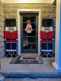 the front door is decorated with red, white and blue decorations