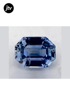 an oval blue sapphire stone with two sides cut in to the center and one side missing