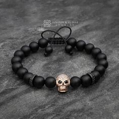 "top jewelry gifts for men and women, gifts for boyfriend, unique gifts ideasSkull Bracelet made with 8mm matte onyx beads, featuring black zircon spacers and rose gold plated Skull with clear stones and black zircon eyes. It's adjustable, utilizing a sliding knot made with macrame cord and is easy to put on and take off by yourself. 2 size options available. Men`s Size : 7\"- 8.5\" (18 cm -21 cm) Women`s Size: 6\"-7.5\" (16 cm -19 cm) All of our jewelry comes in luxury jewelry box and black vel Mens Skull Jewelry, Diamond Skull, Luxury Jewelry Box, Top Christmas Gifts, Gold Skull, Skull Bracelet, Womens Jewelry, Skull Jewelry, Bracelet Blue