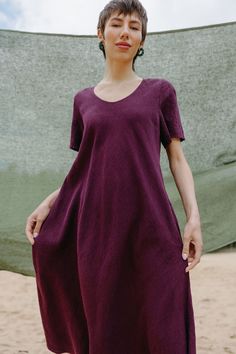 "PRODUCED in 3-5 days FAST & FREE shipping with DHL Express Courier -10% for all items with code \"FAVOURITE\" Featuring a rich plum shade and flowy silhouette, this dress is perfect for your style and comfort. Match it with your favorite accessories and feel unique! Details: - 100% Linen - Pure linen fabric - Scoop neck - Short sleeves - Flowy silhouette - Two side pockets - Calf length - Model's height is 167 cm / 5′6″ wears size L - Code: E9041-L532-251 The dress is available in other colors. Purple Relaxed Fit Short Sleeve Dress, Short Sleeve Linen Maxi Dress, Maxi Linen Dress, 5 Day Fast, Purple Linen, Purple Maxi, Long Linen Dress, Dress With Short Sleeves, Linen Maxi Dress