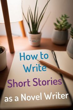 a book with a pen on top of it next to a potted plant and an open notebook