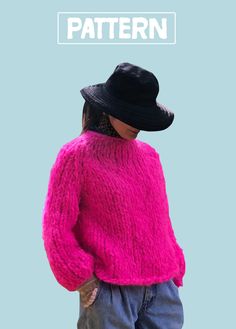 a woman wearing a pink sweater and black hat with the words pattern on it in white