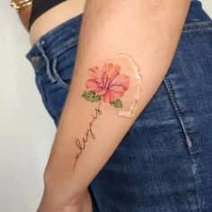 a woman's arm with a flower on it and the word faith written in cursive writing