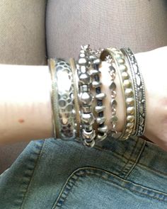 Vintage Bracelets Aesthetic, Grunge Accessories Aesthetic, Indie Sleaze Jewelry, Y2k Bracelets Aesthetic, Vintage Bracelets Silver, Silver Bracelet Stack Aesthetic, Silver Bangles Aesthetic, Jewelry Silver Aesthetic, Lots Of Bracelets On Wrist