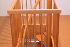 a wooden stair case in the corner of a room