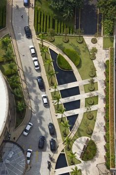 an aerial view of a parking lot with cars parked in it