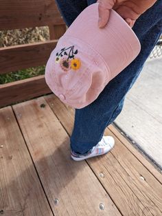 Handmade Playful hand-embroidered pink, mustard yellow, and light yellow sunflowers embellish the left side of this light pink 100% cotton baseball hat. One size fits most with adjustable back strap. Pink Cotton Hat With Embroidered Logo, Cute Spring Cotton Baseball Cap, Cute Cotton Baseball Cap For Spring, Pink Cotton Summer Baseball Cap, Pink Cotton Baseball Cap For Summer, Pink Cotton Hat For Spring, Cute Pink Embroidered Hat, Spring Cotton Hats With Floral Embroidery, Cotton Baseball Cap With Floral Embroidery